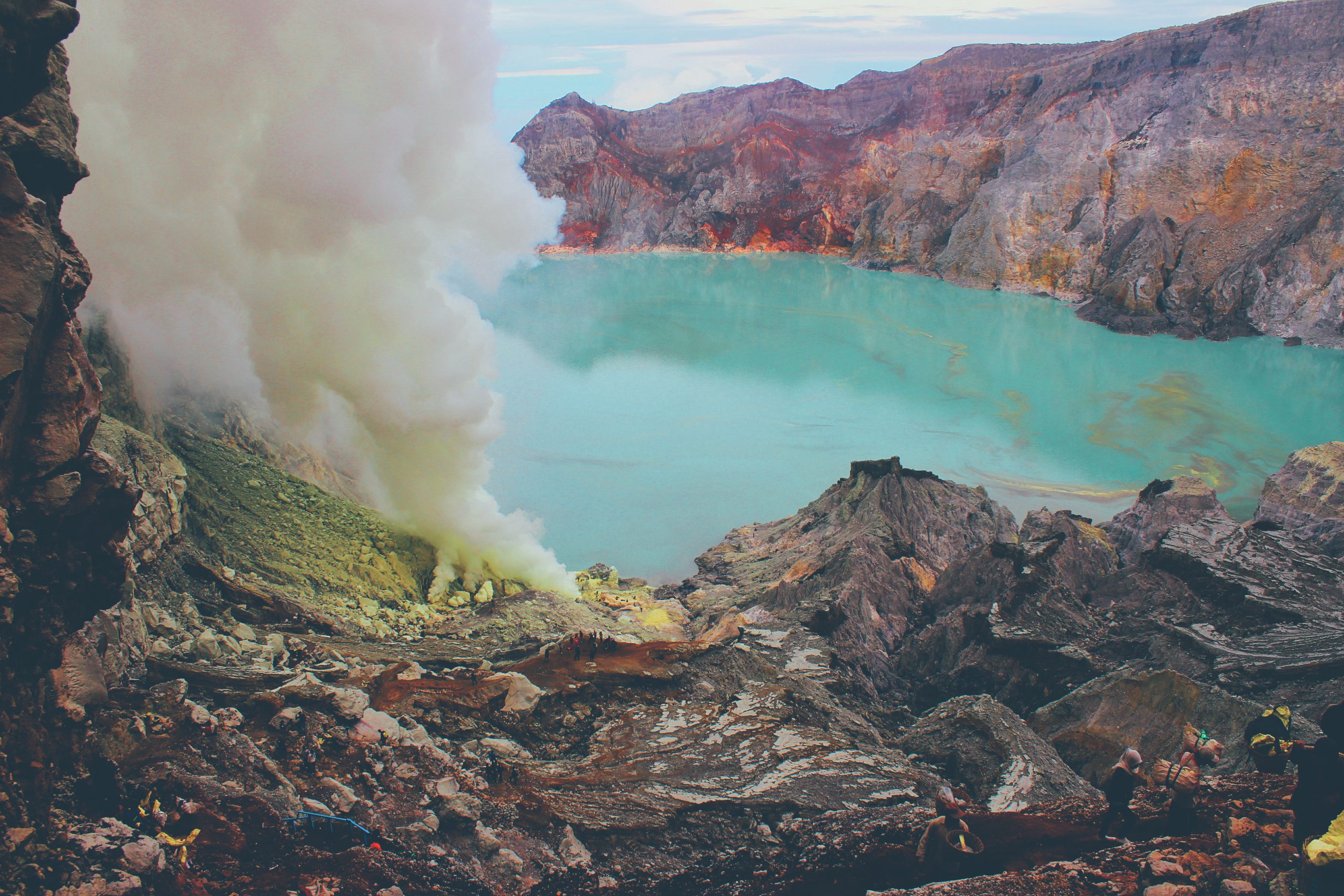 View of Ijen crater lake and steaming fumarole. Jave , Indonesia