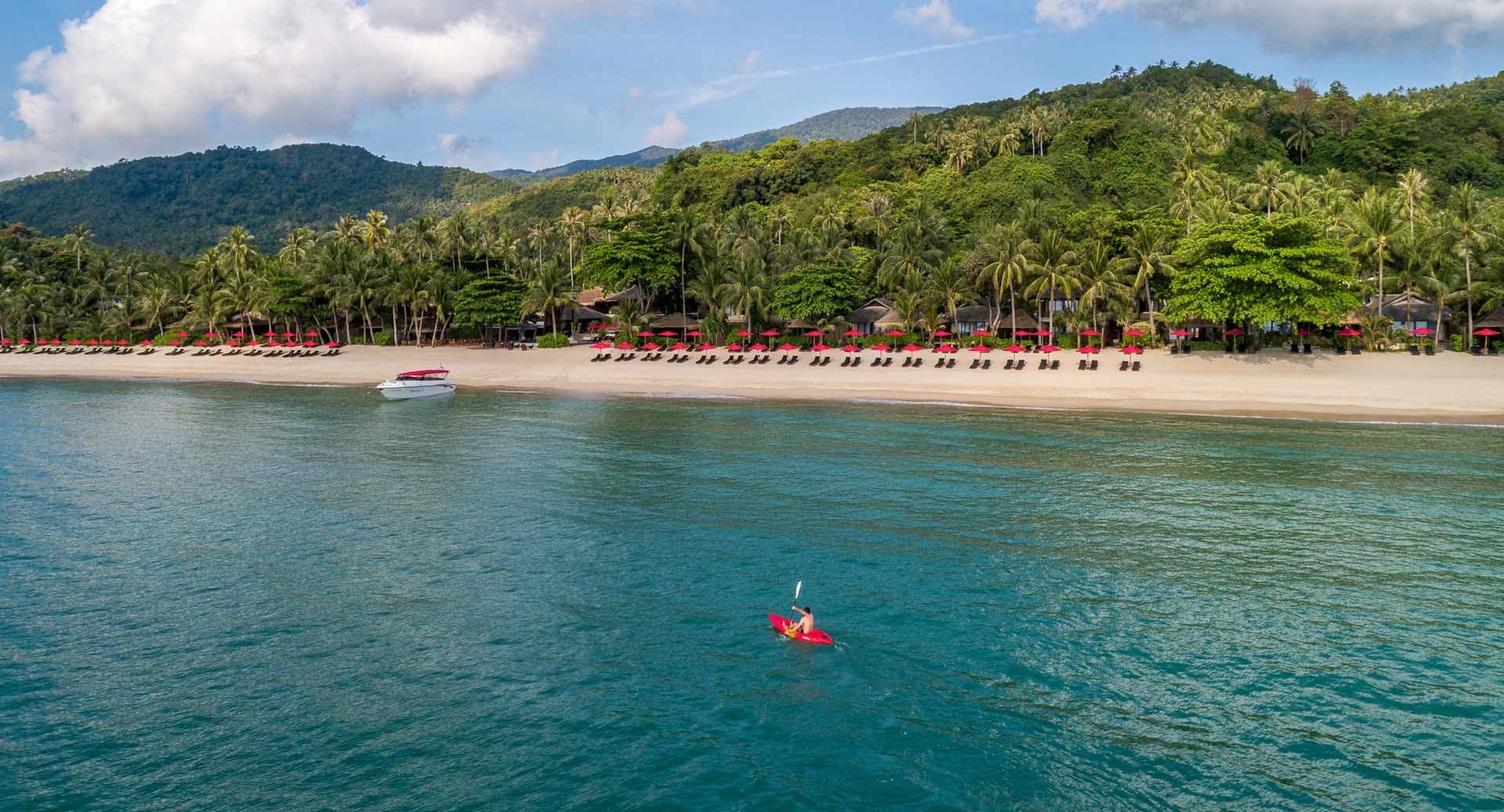 Aerial view of sea kayaker infront of Anantara Rasananda