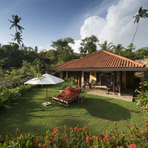 Exterior view of Ocean Villa, front garden and sunloungers