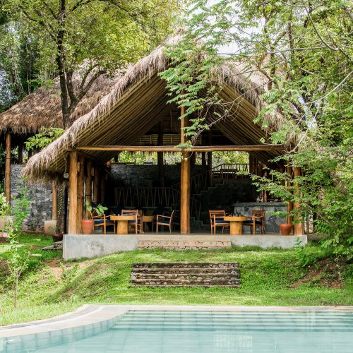 Exterior view of pool, bar and reception area